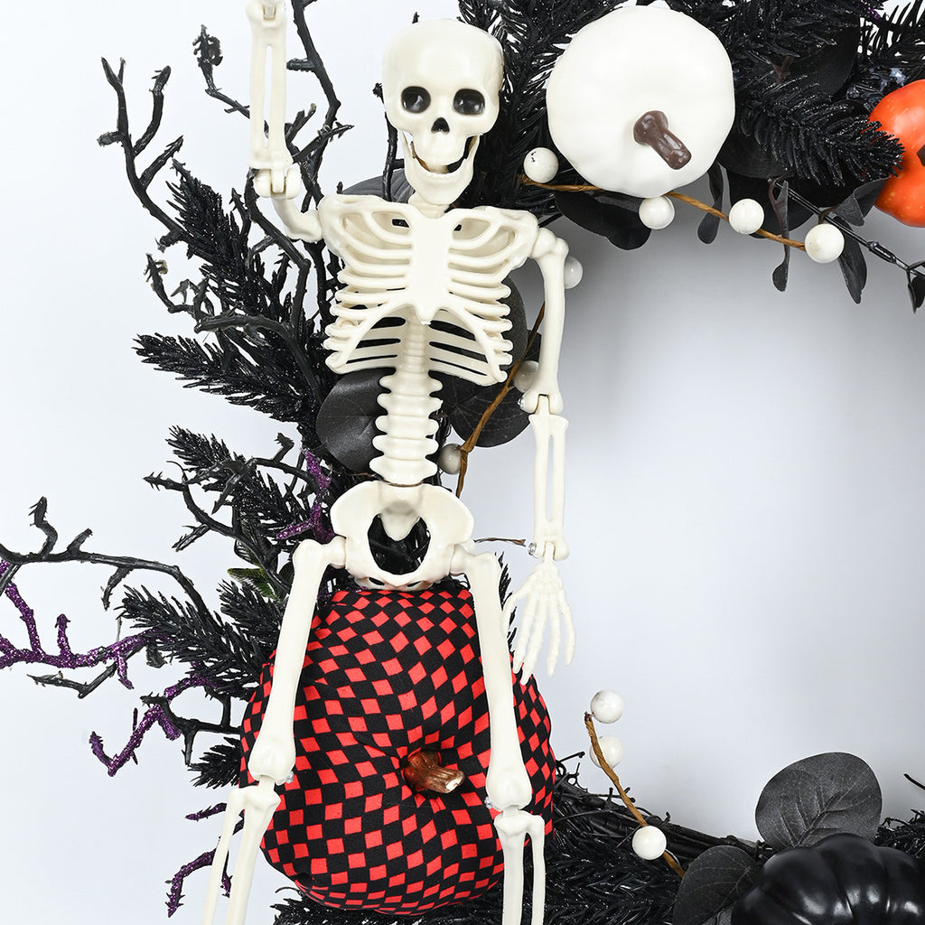 Couronne d’Halloween avec citrouille, crâne et branches décoratives