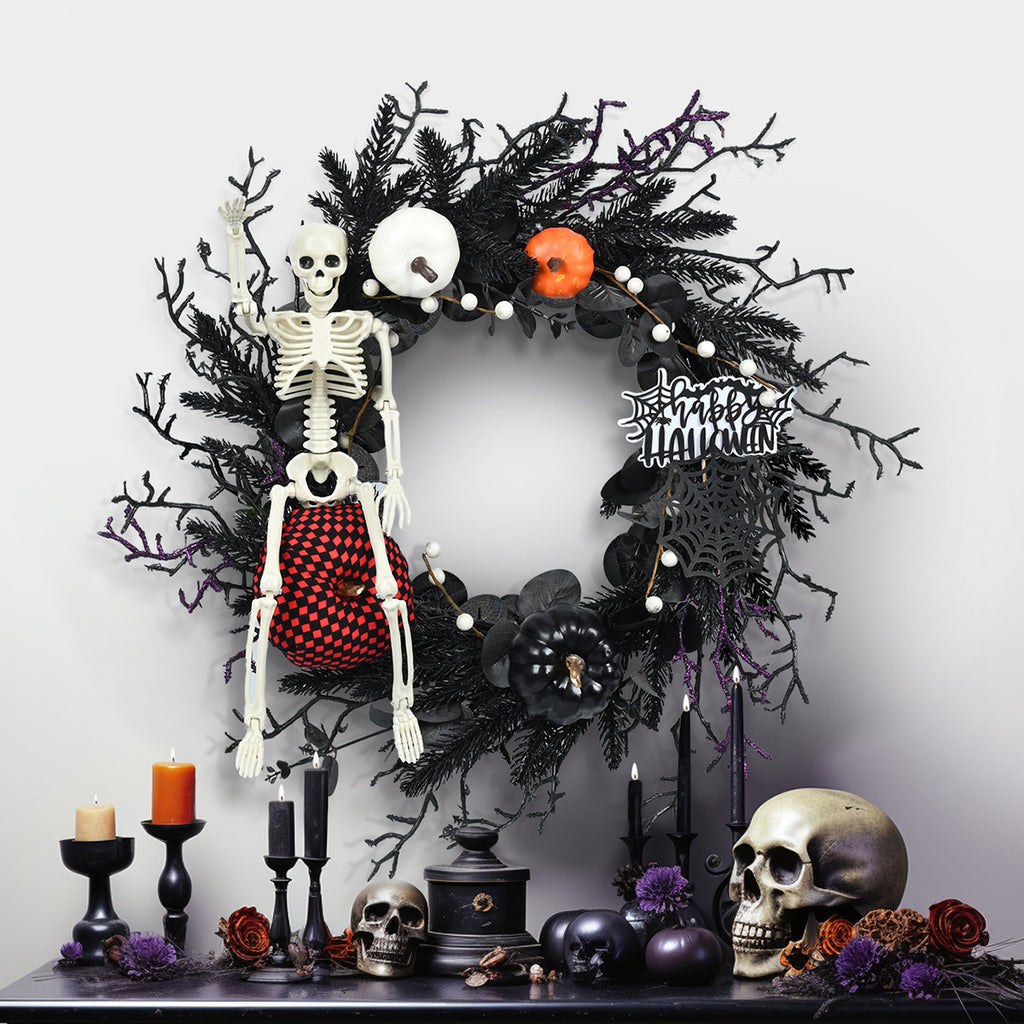 Couronne d’Halloween avec citrouille, crâne et branches décoratives